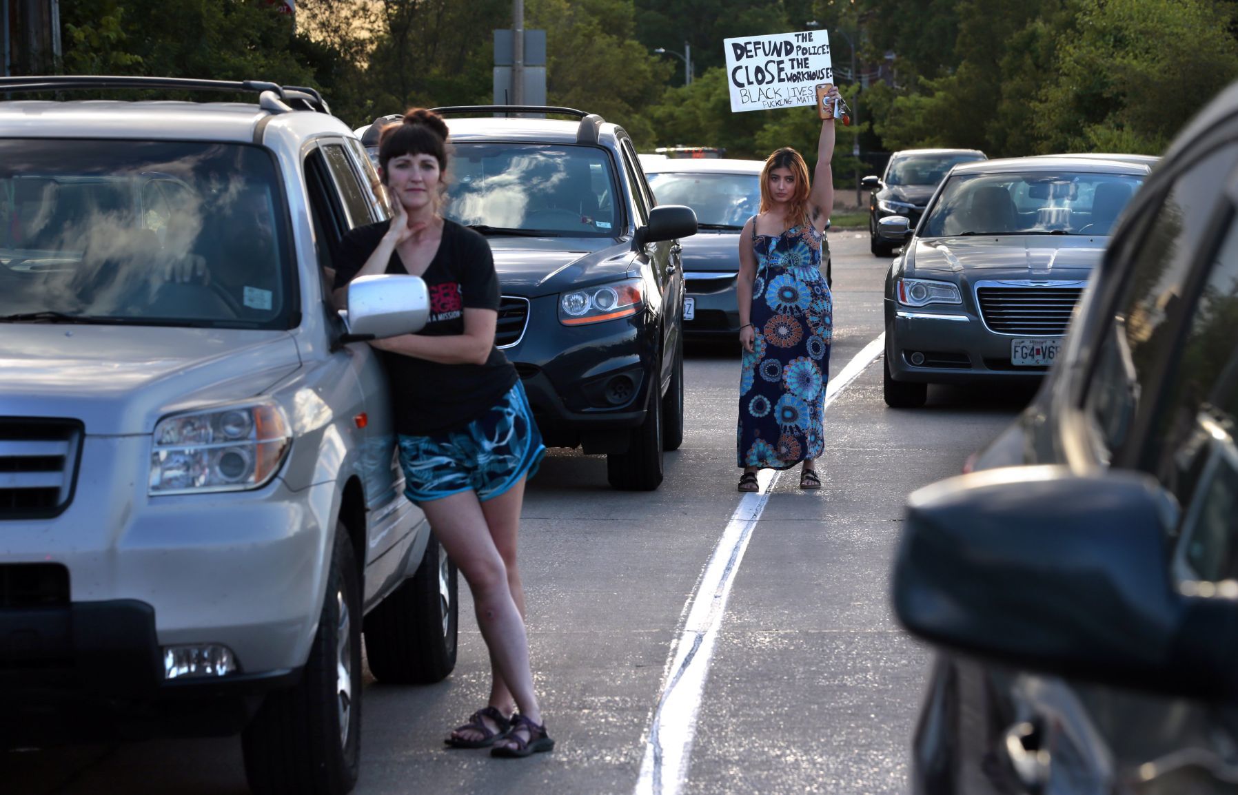 Protesters march through the Delmar Loop